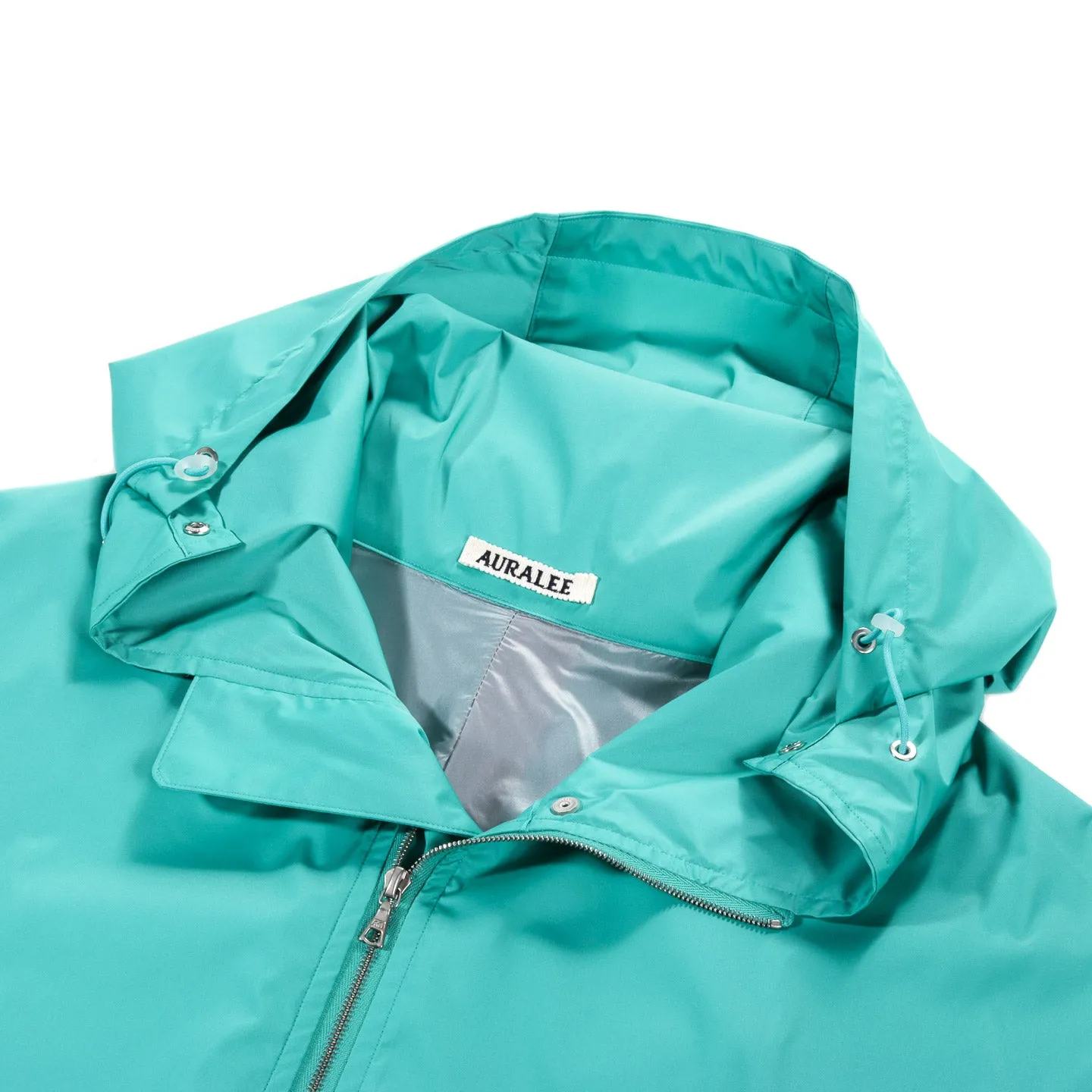 AURALEE HARD TWIST POLYESTER SATIN LAMINATE ZIP BLOUSON TURQUOISE